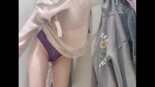 Russian Sudent trying on a Dress in a Fitting Room